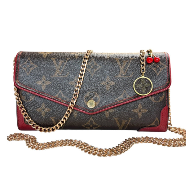 LOUIS VUITTON Red Monogram Retro Sarah Wallet with added Chain/Charm Louis Vuitton
