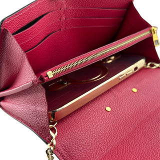 LOUIS VUITTON Hot Pink Empreinte Leather Metis Wallet with added Gold Chain Louis Vuitton