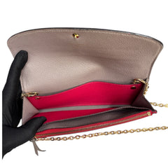 LOUIS VUITTON Pink Monogram Empreinte Emilie Wallet with added Chain