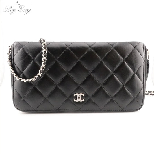 CHANEL Black Quilted Lambskin Zip Wallet with Added Chain - Bag Envy