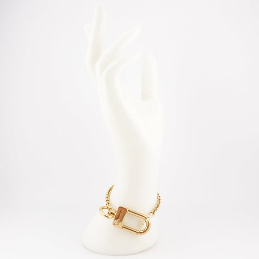 LOUIS VUITTON Gold Clasp and Clover Bracelet - Bag Envy