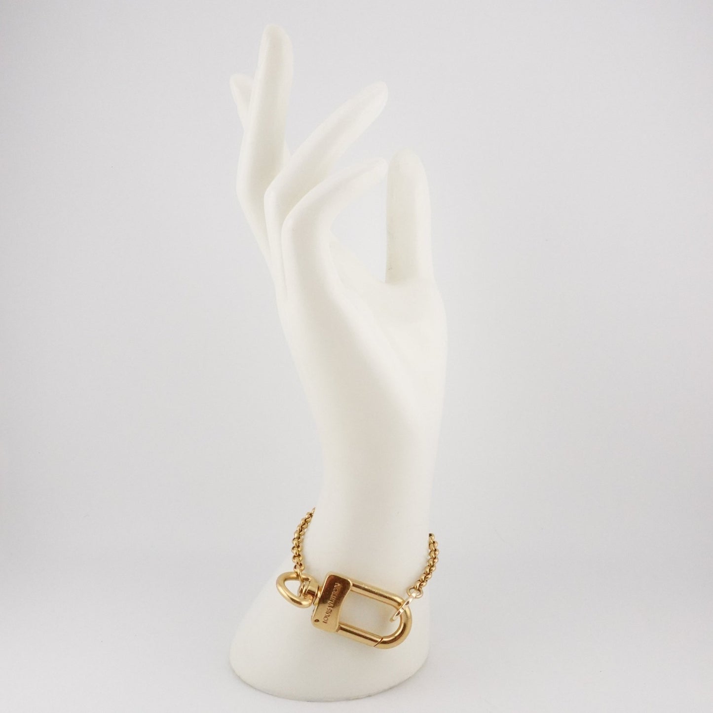 LOUIS VUITTON Gold Clasp and Clover Bracelet - Bag Envy