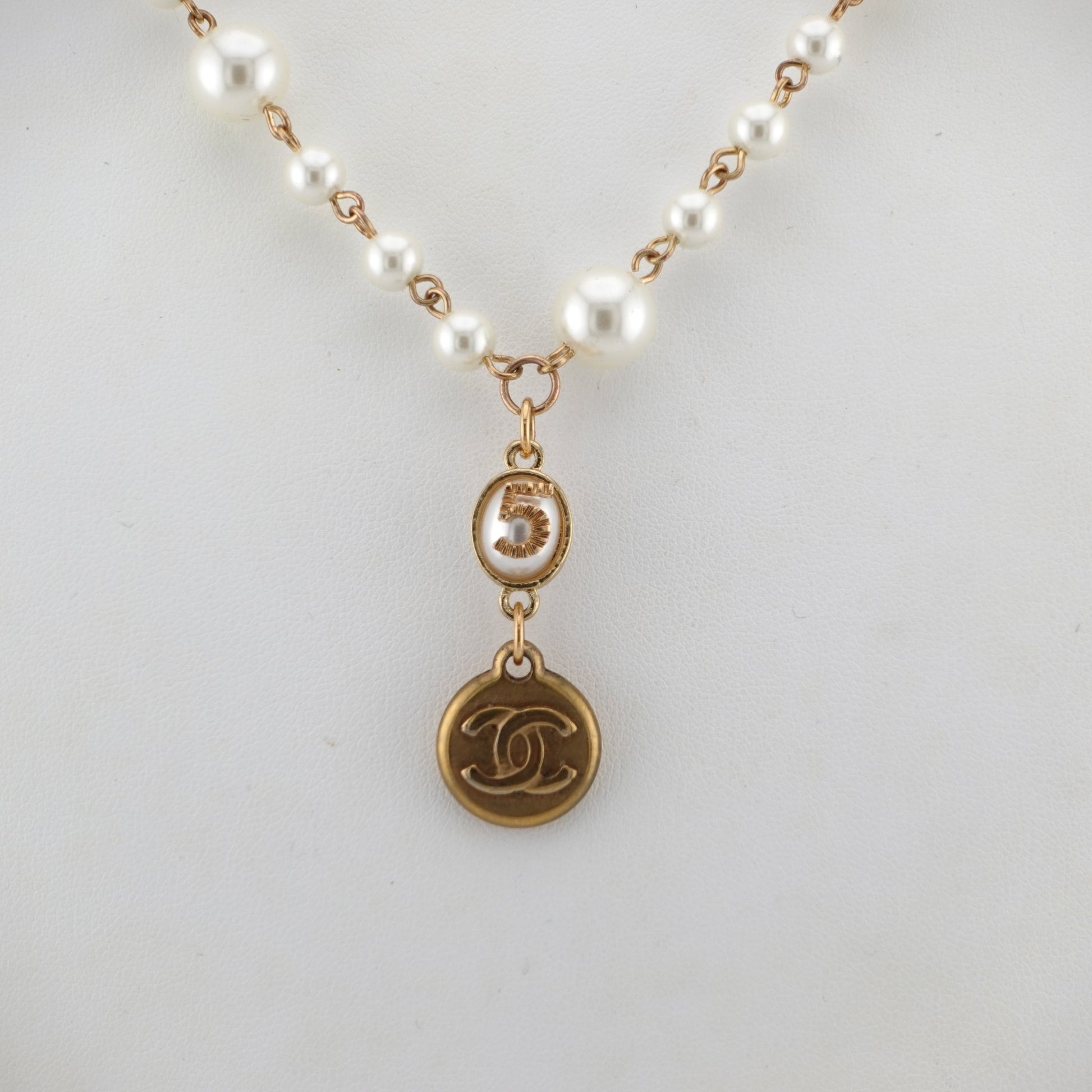 CHANEL Gold CC Logo Charm on Faux Pearl Necklace - Bag Envy